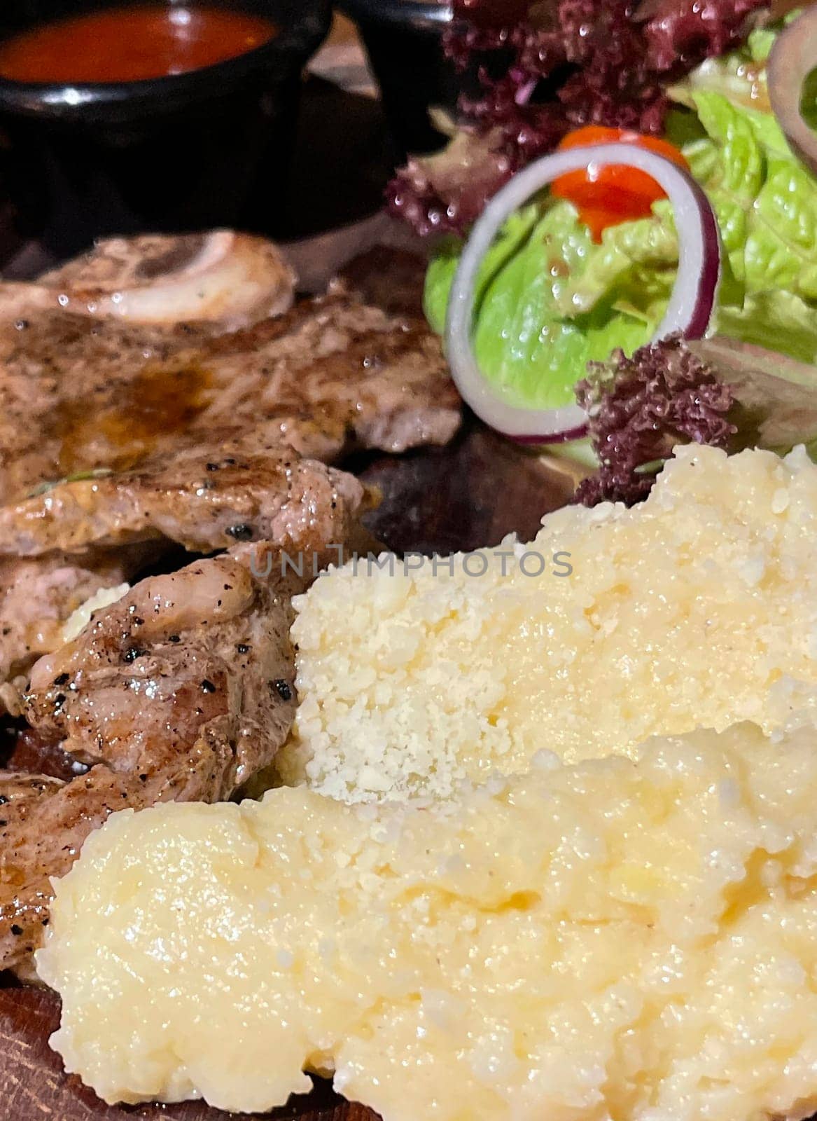 prime sirloin beef steak along with mash potatoes with delicious mushroom sauce and green salad onion new york sirloin