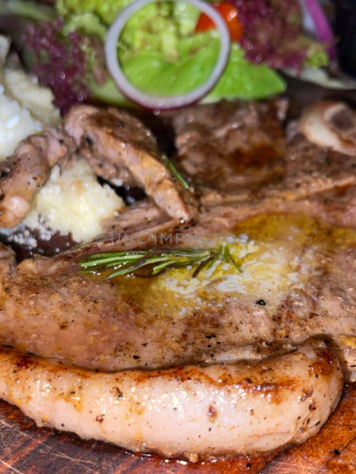 prime sirloin beef steak along with mash potatoes with delicious mushroom sauce and green salad onion new york sirloin