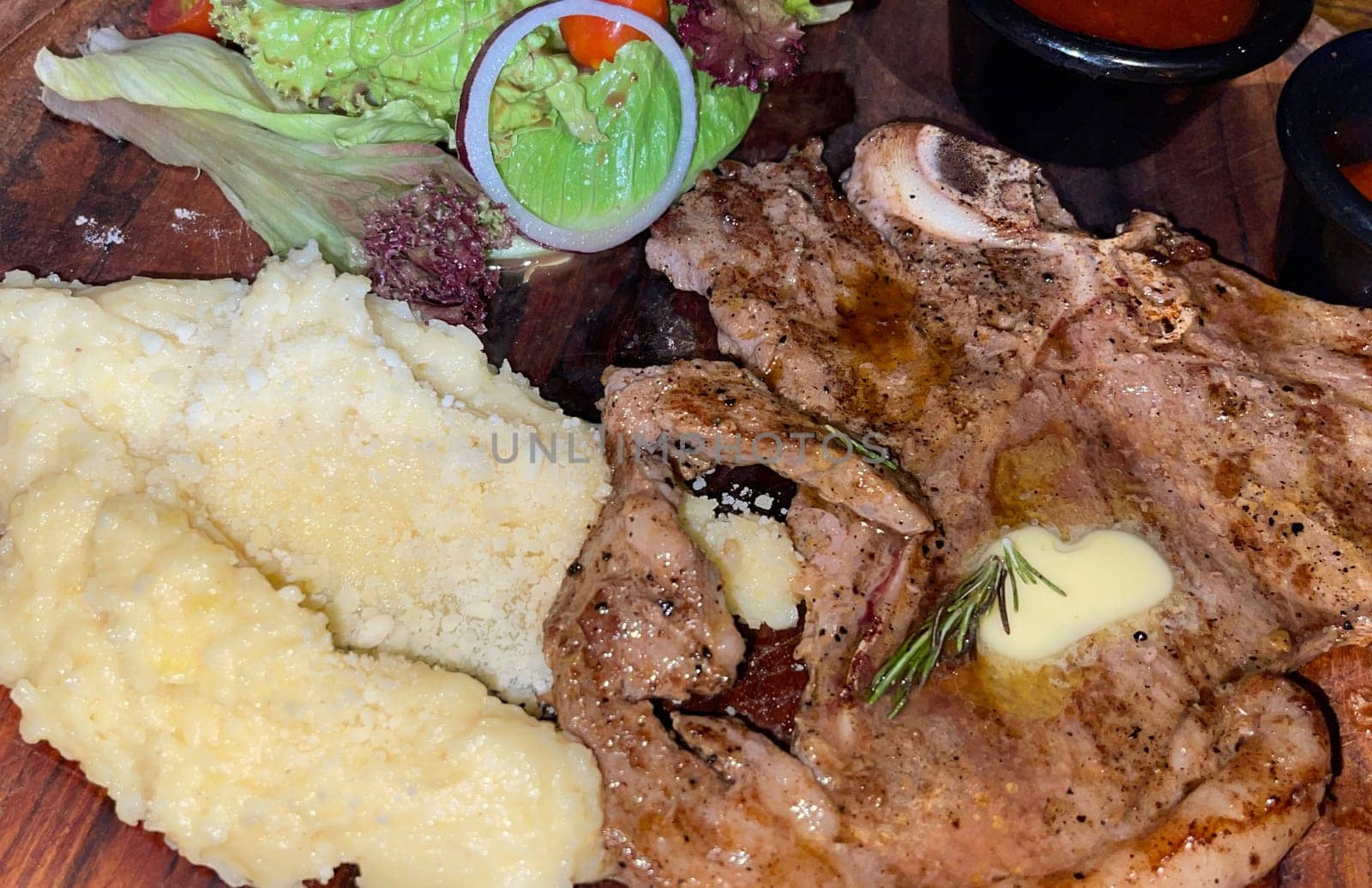 prime sirloin beef steak along with mash potatoes with delicious mushroom sauce and green salad onion new york sirloin