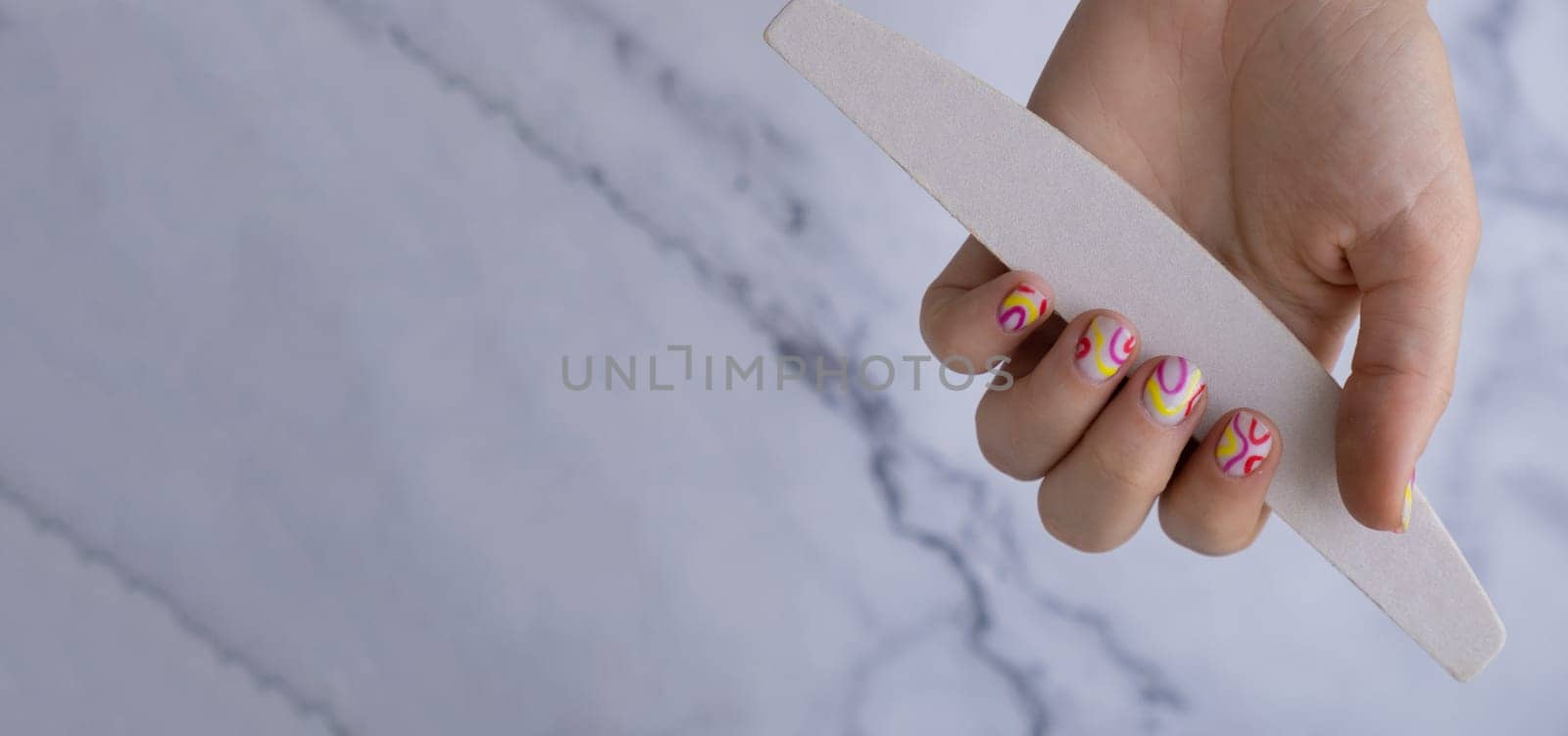 Manicure tools Stylish colorful summer female nails. Modern trendy stylish Beautiful manicure. Cute pastel nail minimalistic design concept of beauty treatment. Gel nails. Skin care. Beautician