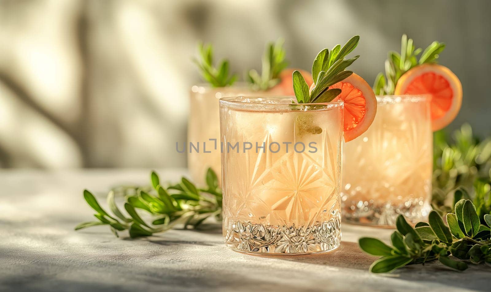 A light cocktail in a glass on the table. Selective soft focus.