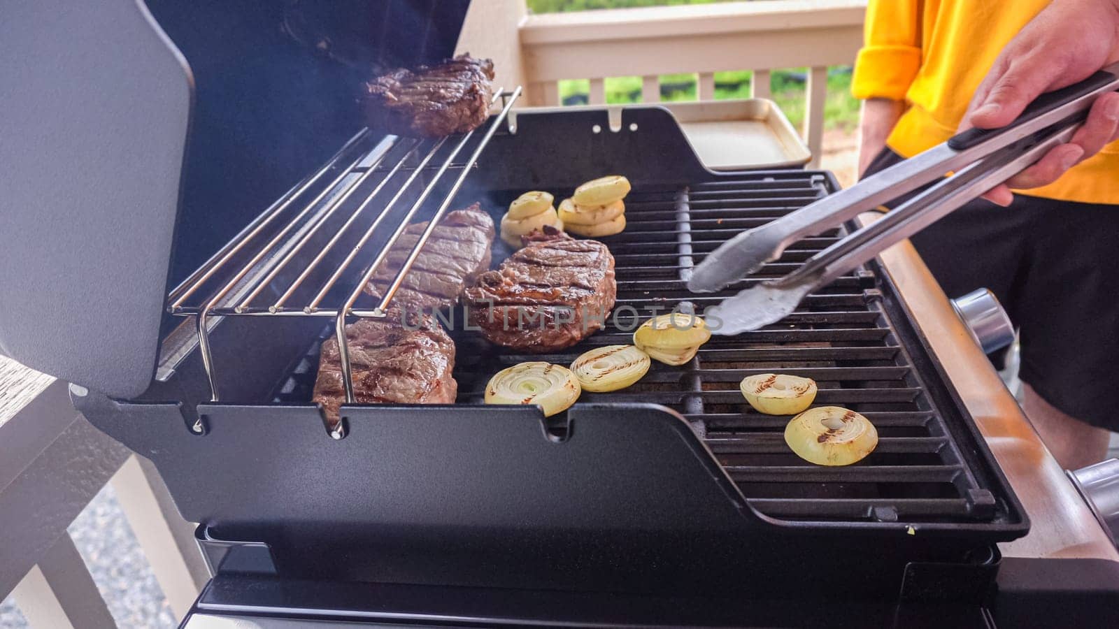 Outdoor Cooking. Grilling Dinner on Two-Burner Gas Grill by arinahabich