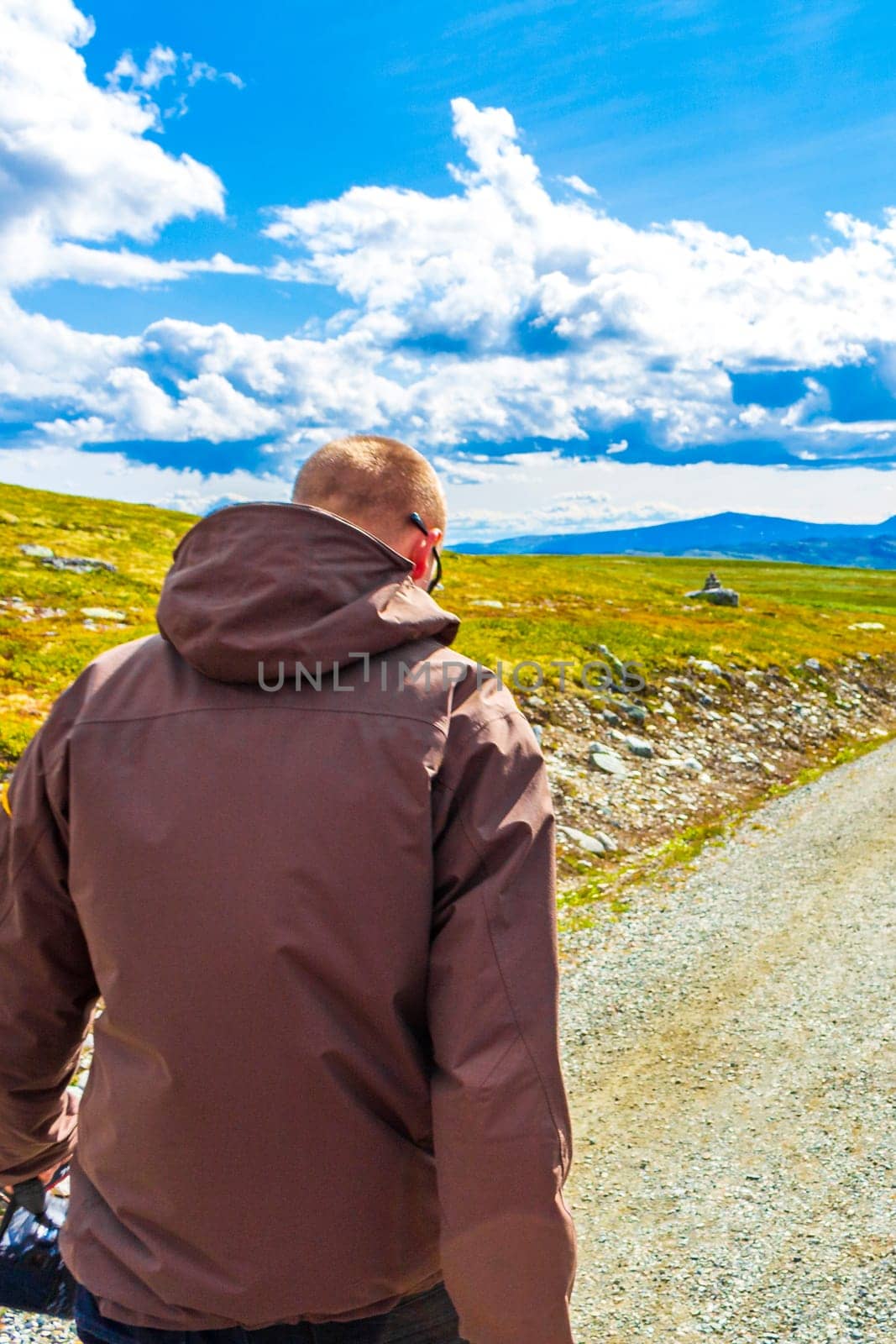 Young hiker and mountains landscape panorama Rondane National Park Norway. by Arkadij