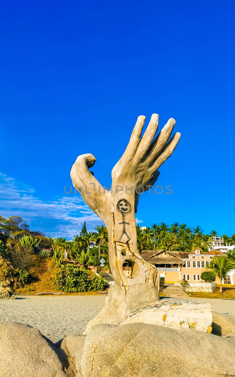 Puerto Escondido Oaxaca Mexico 01. December 2022 Hands made of stone rock statue sculpture on the beach in Zicatela Puerto Escondido Oaxaca Mexico.