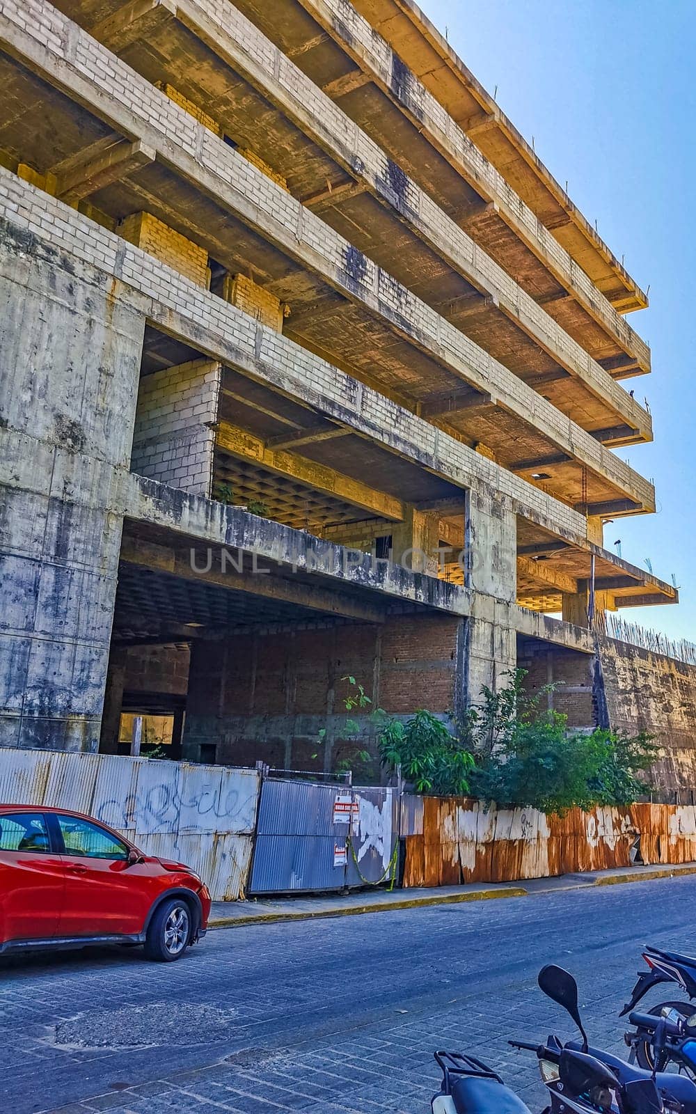 Huge gigantic construction stop building ruin in Puerto Escondido Mexico. by Arkadij