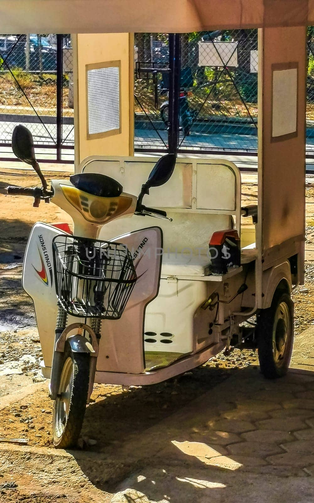White tuk tuk tricycle TukTuks rickshaw in Mexico. by Arkadij