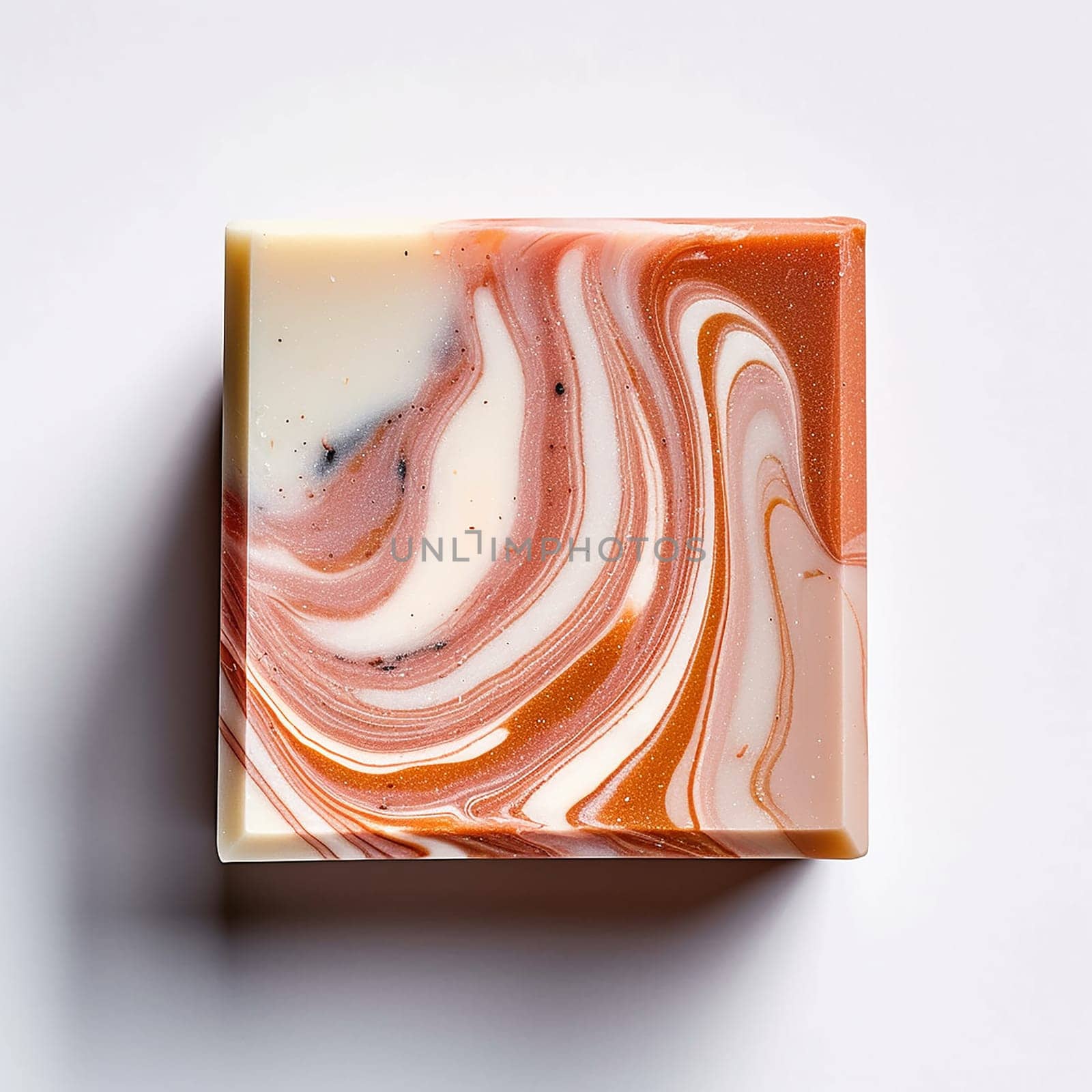 Handmade swirl patterned soap bar on a white background.