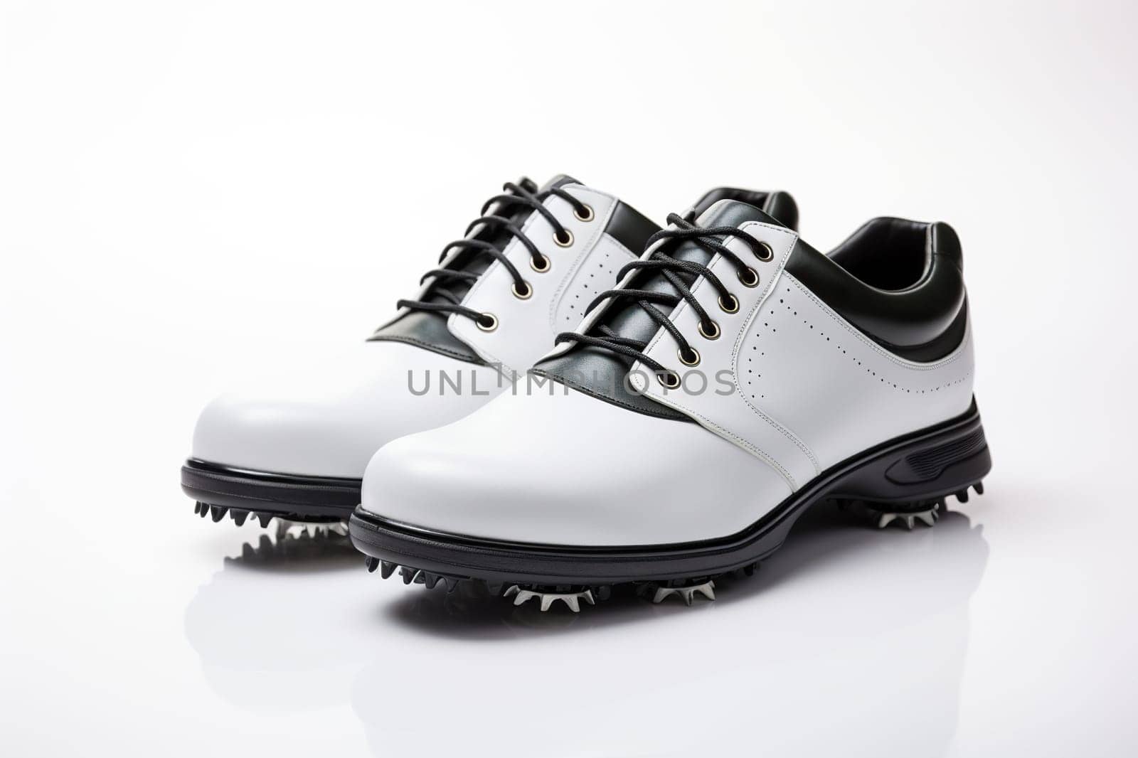 A pair of white leather golf shoes on a white background.
