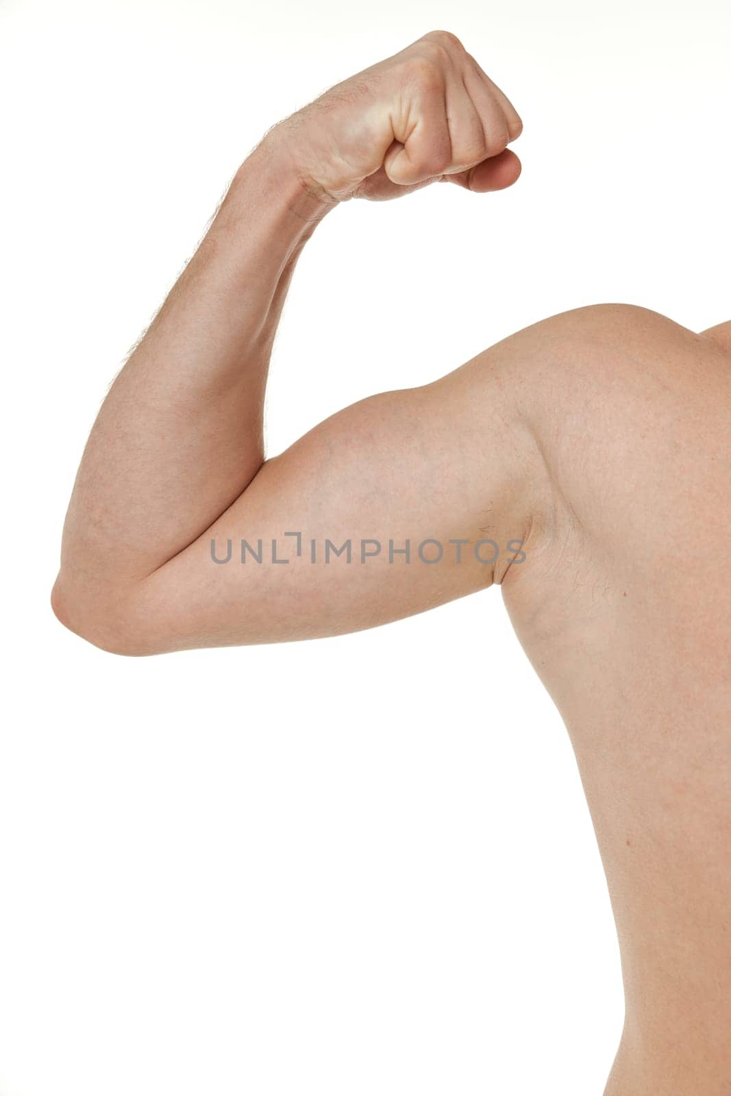 young man showing his bicep on white background by erstudio