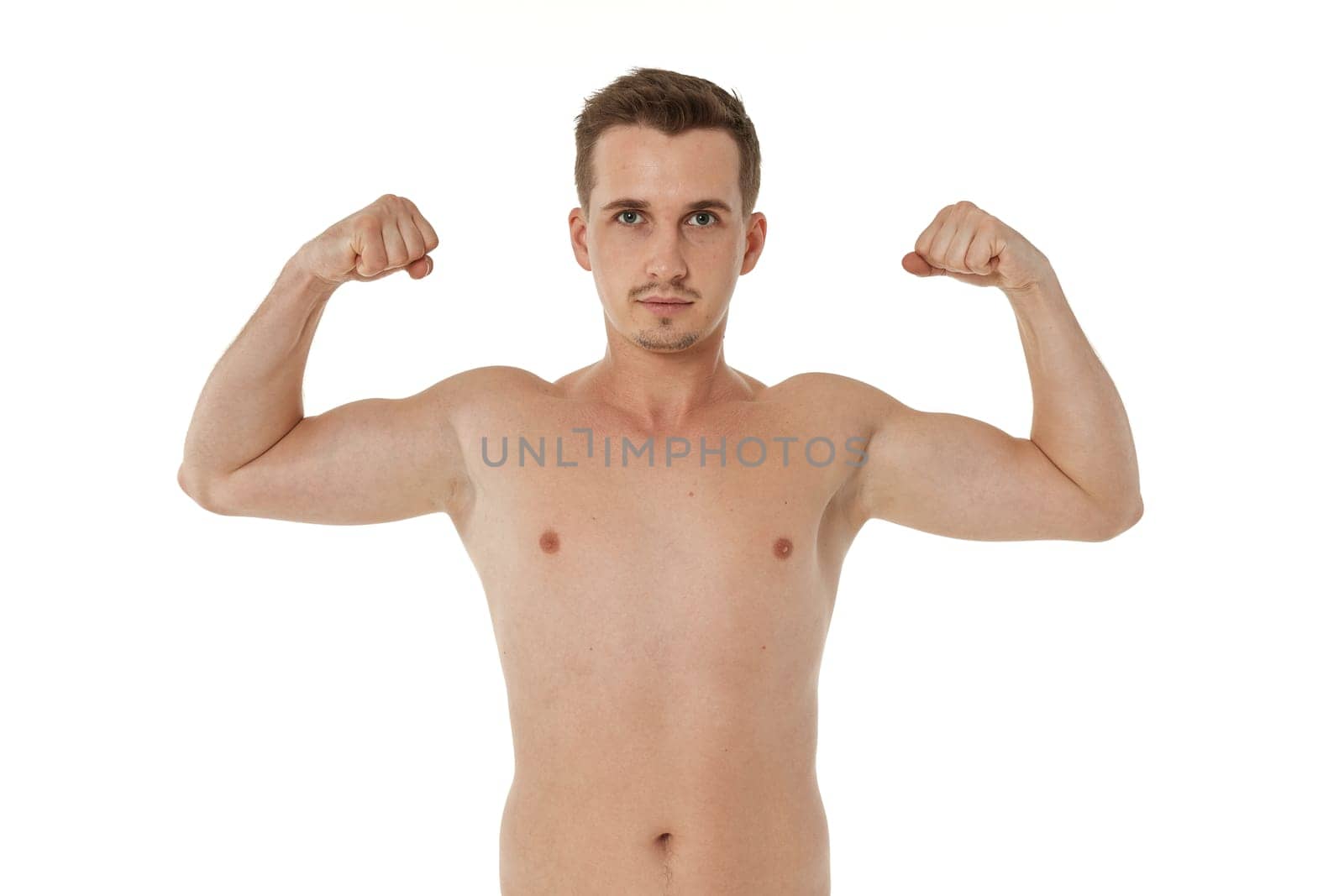 young man showing his bicep over white background