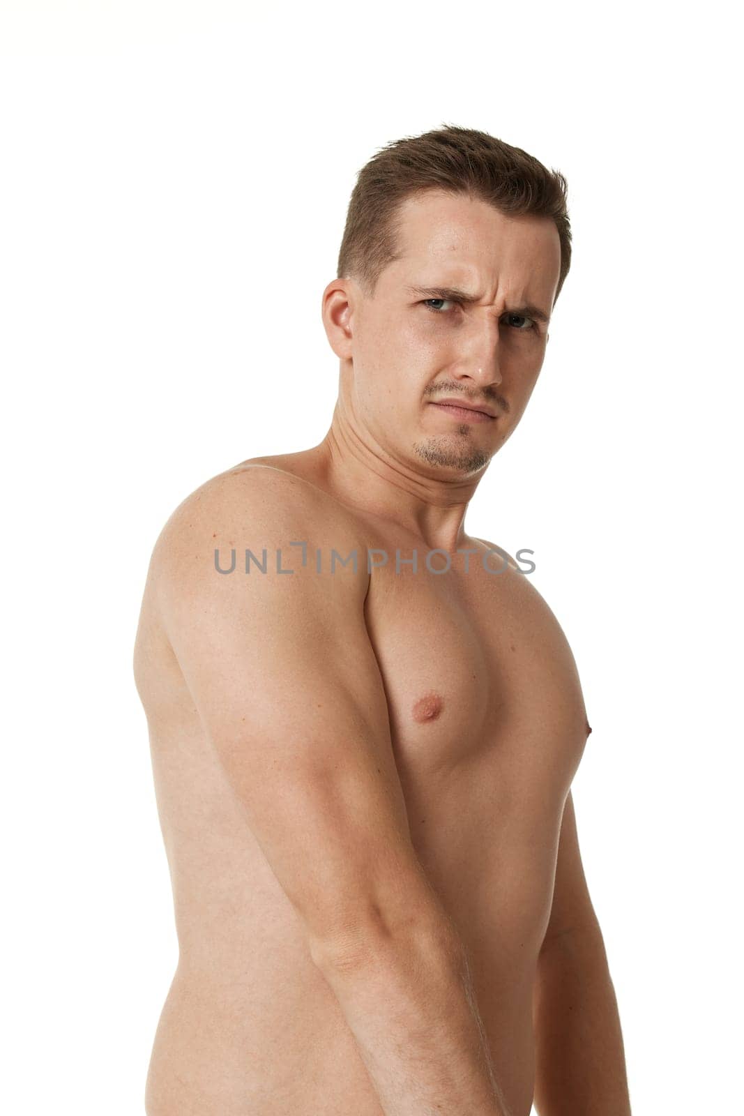 young man showing his bicep over white background