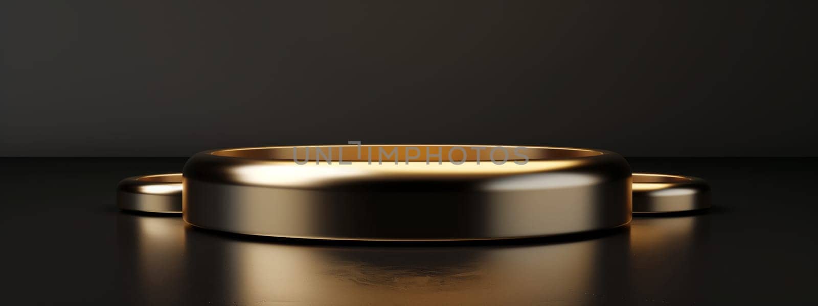 A gold ring is resting on a sleek black surface next to a portable communications device. The shiny metal contrasts with the electric blue of the gadget, creating an intriguing event in the room