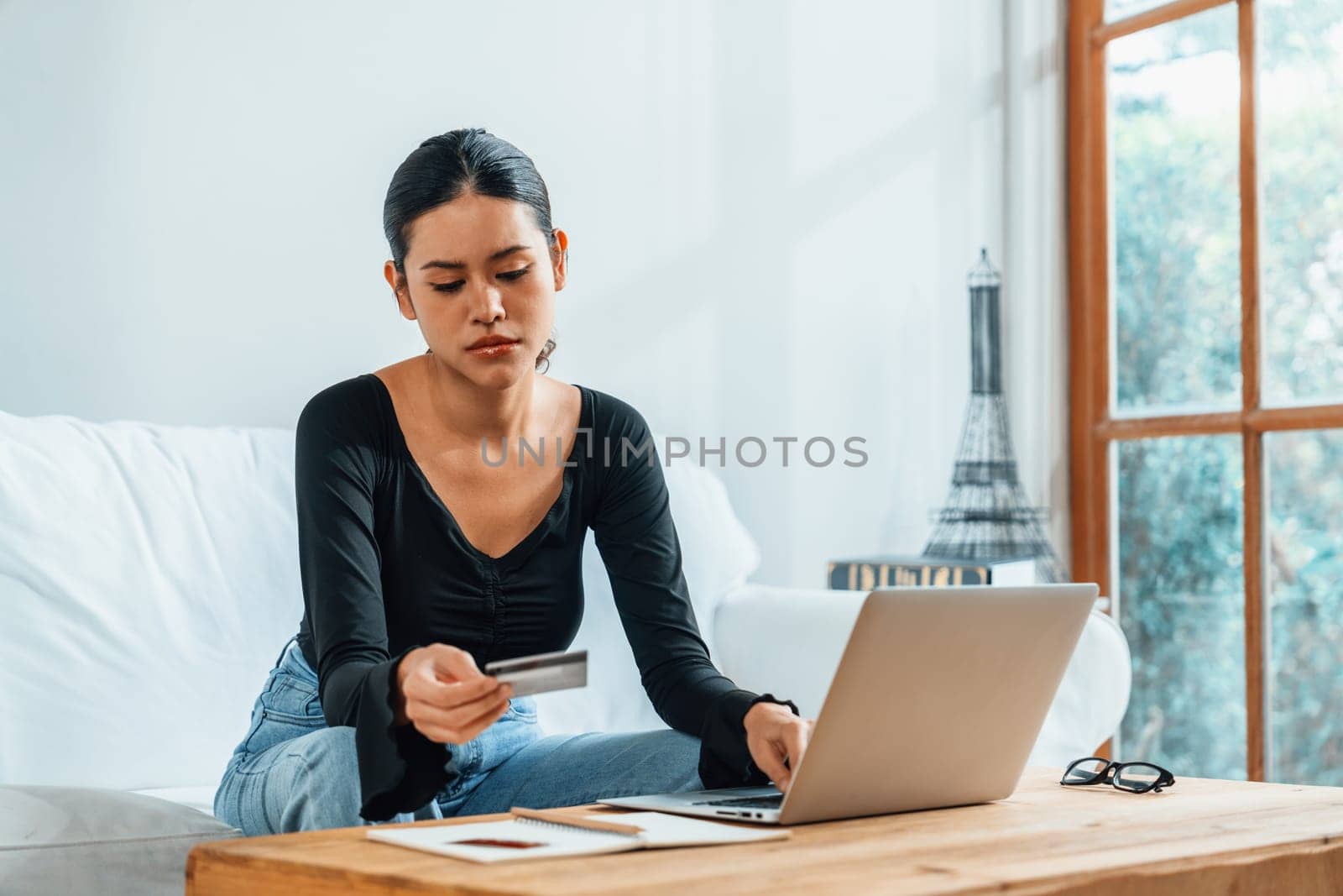Stressed young woman has financial problems with credit card debt to pay uttermost show concept of bad personal money and mortgage pay management crisis.