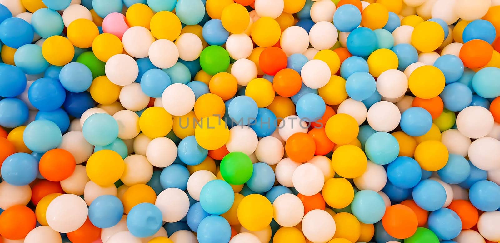 plastic color balls on children playground in a mall by antoksena