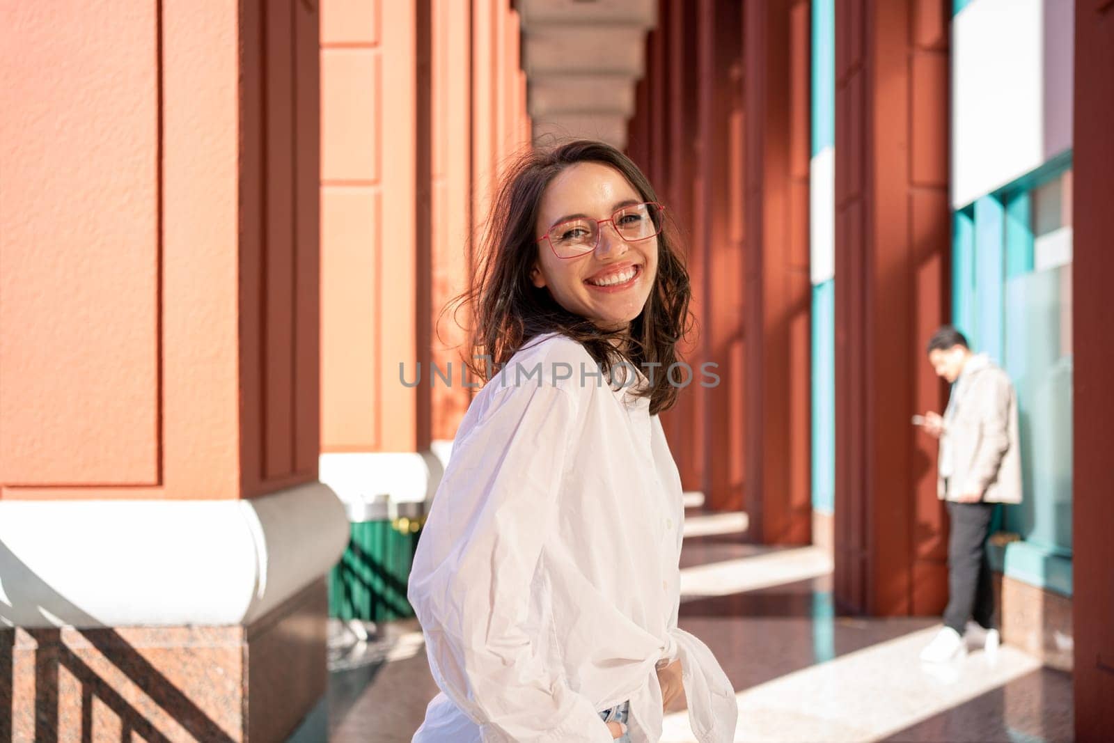 Successful smiling business woman wearing eyeglasses. Modern businesswoman laugh standing outdoor dressed white shirt. Business woman happy positive emotions