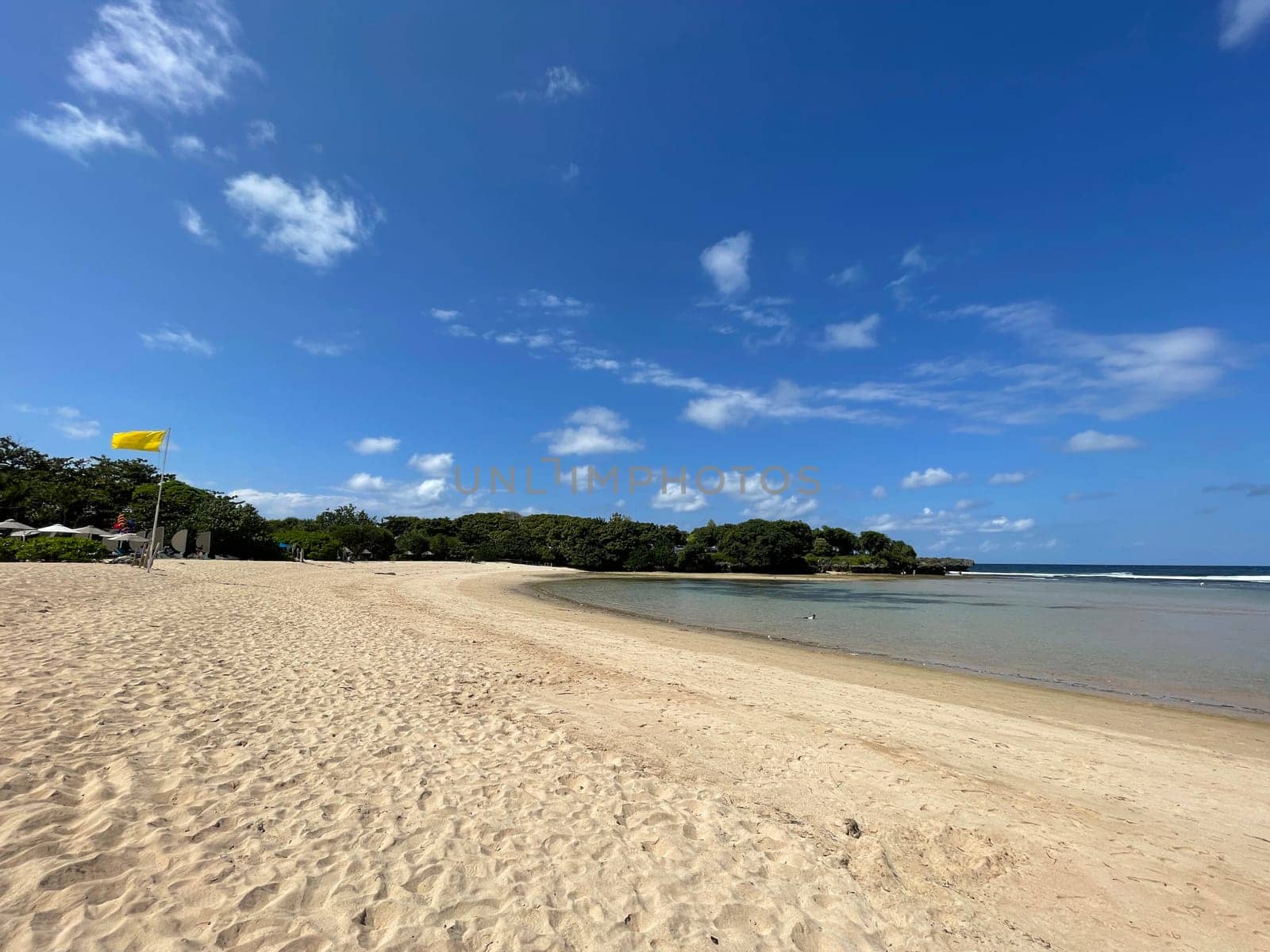Tropical beach in sunny weather with blue sky and white sands Panorama of a beautiful white sand beach and turquoise water, Holiday summer beach background Wave of the sea on the sand beach