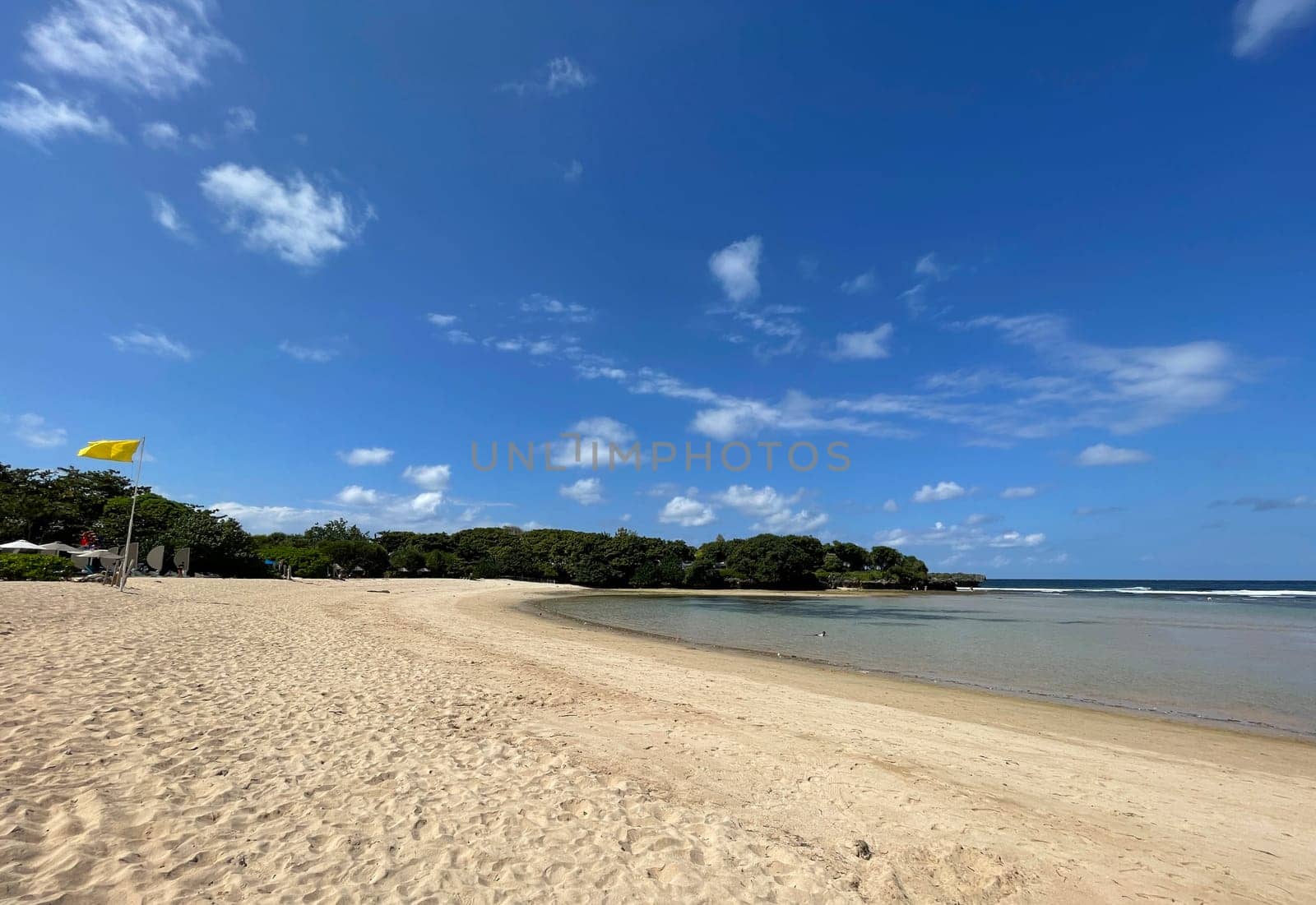 Tropical beach in sunny weather with blue sky and white sands Panorama of a beautiful white sand beach and turquoise water, Holiday summer beach background Wave of the sea on the sand beach