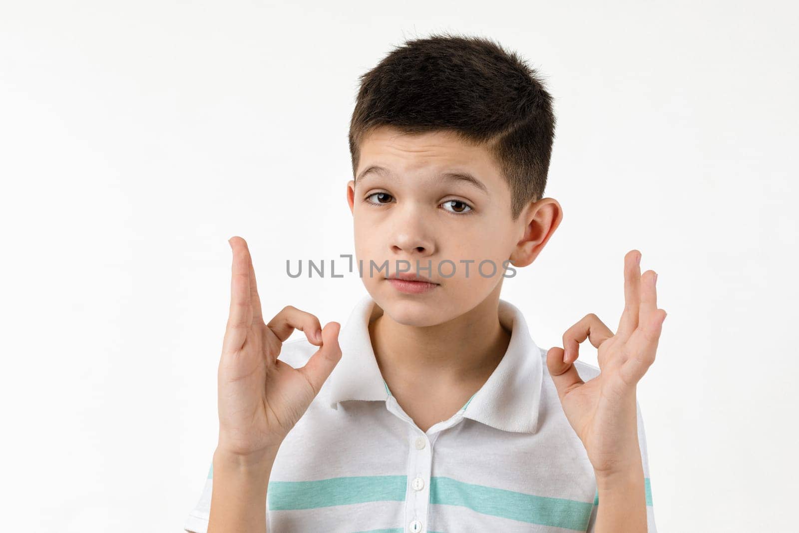 cute little boy in t-shirt making Ok gesture by erstudio