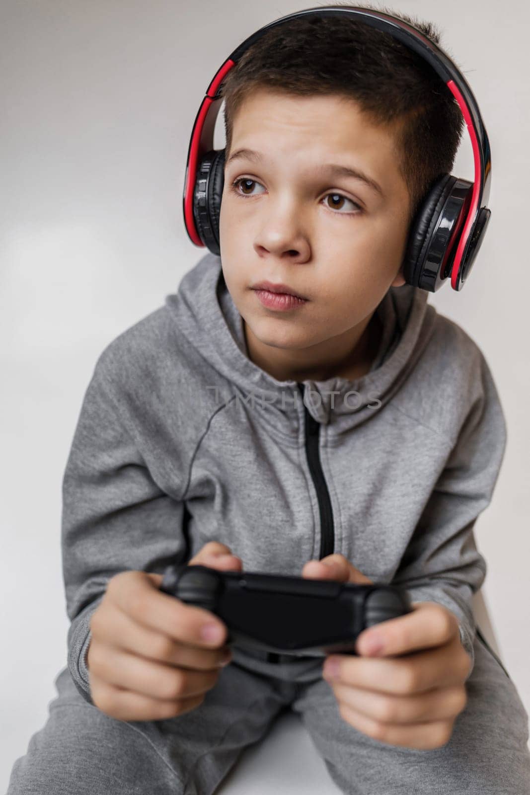child boy playing video games by erstudio