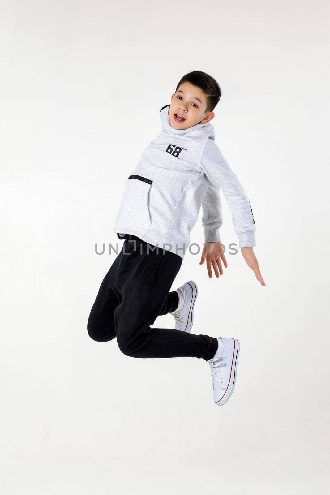 Little boy jumping by erstudio