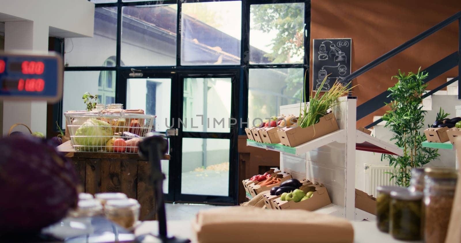 Bulk products stored in reusable jars used by environmentally friendly supermarket to lower carbon footprint. Local shop selling homegrown fruits and vegetables, biodegradable packaging.