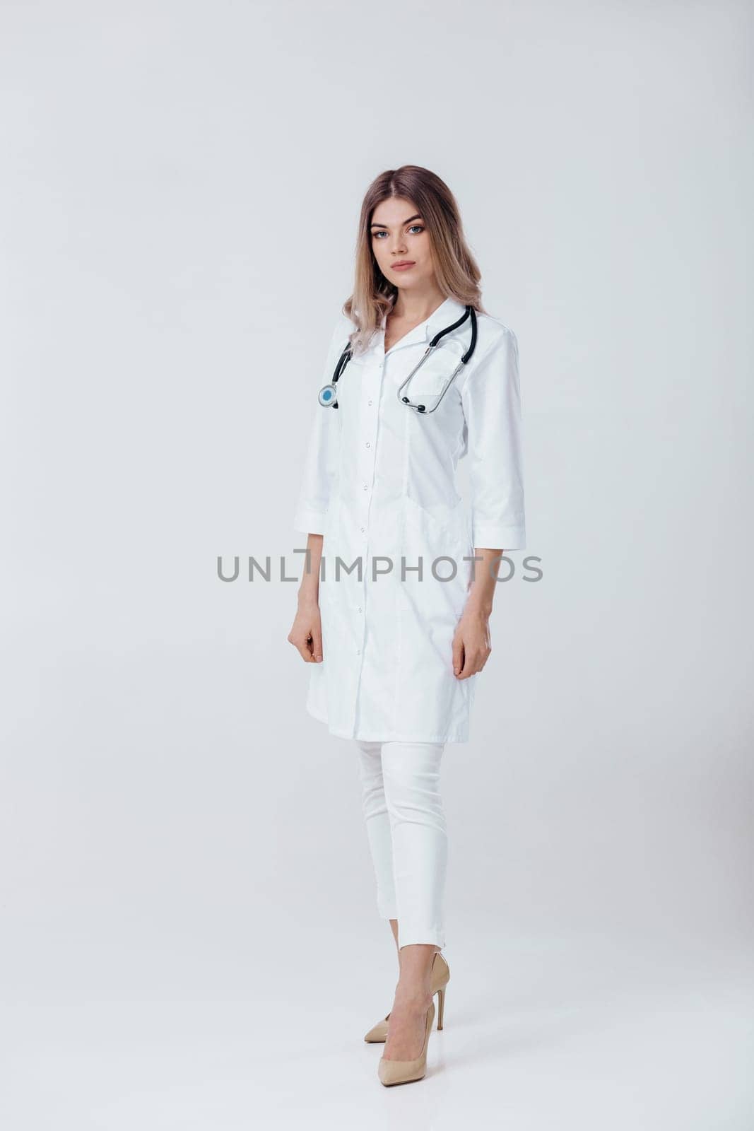 doctor woman in white coat with stethoscope by erstudio