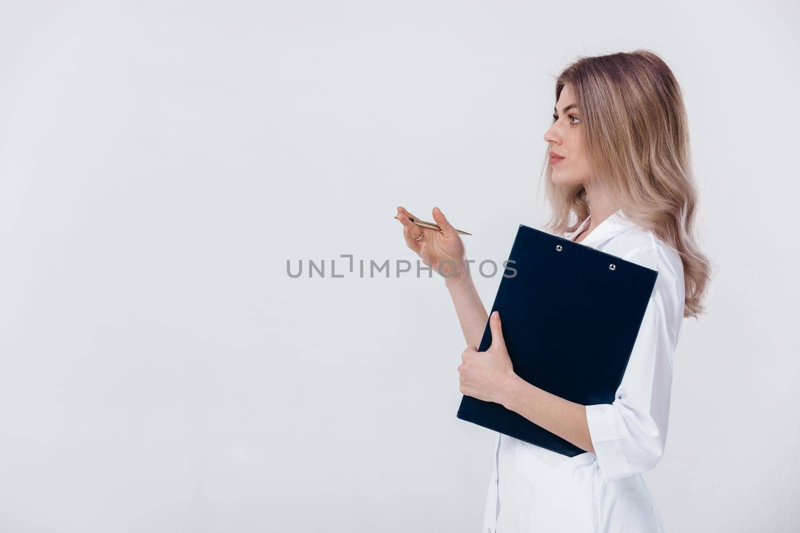 Medical physician doctor woman in white coat holds folder by erstudio