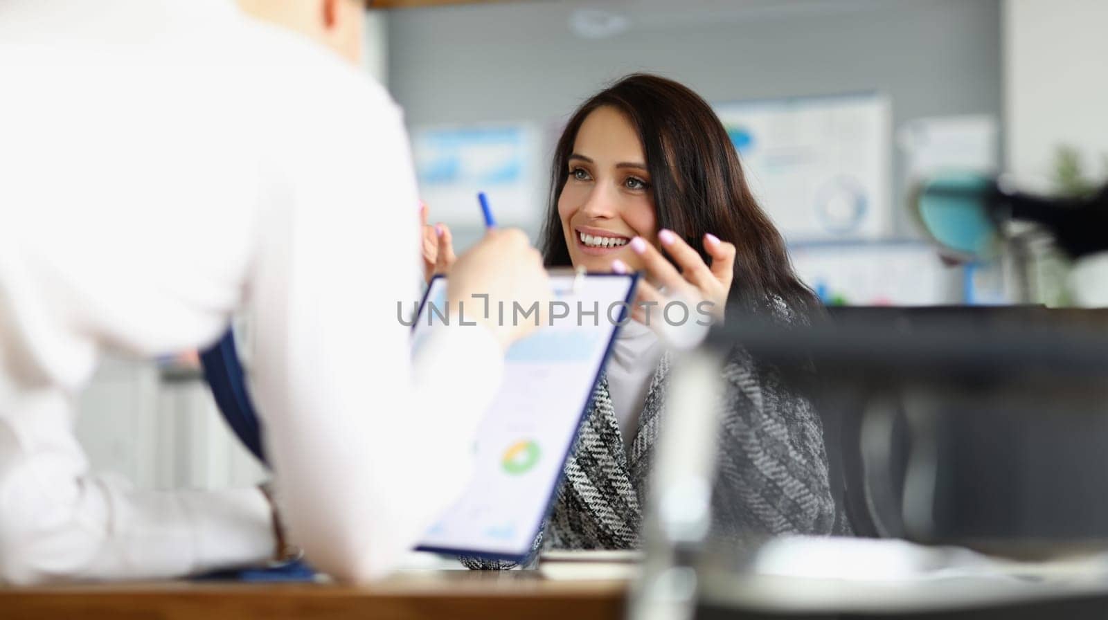 Business people discussing documents with graphs in office. Business partnership concept