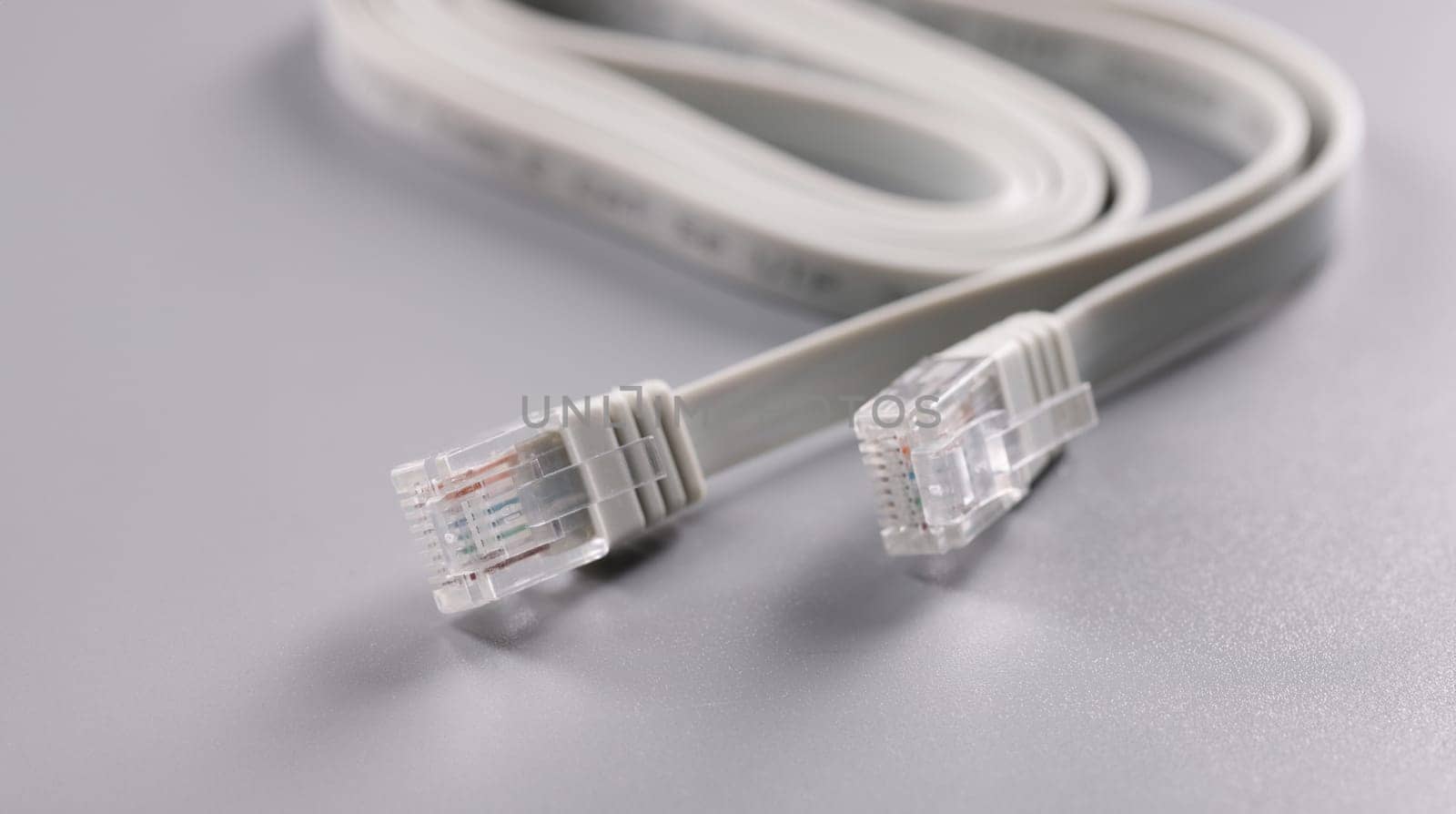 Closeup of rj45 cable on gray background by kuprevich