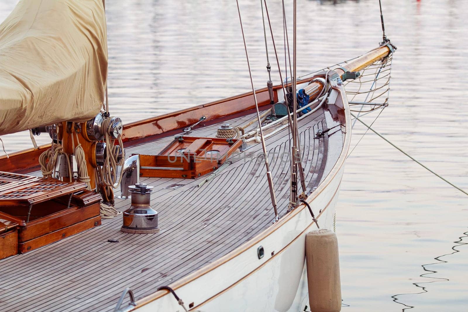 An old-fashioned yacht docked in detail