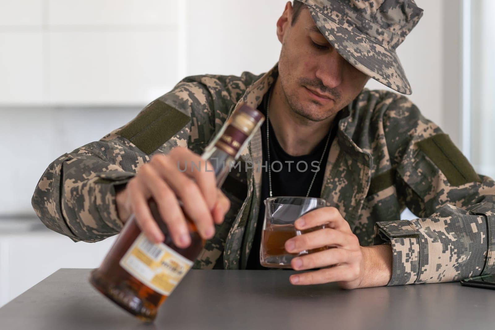 one man sit at home with bottle of liquor drink whiskey drunk alcoholic Alcohol abuse, addiction and man depression concept drink and drive copy space hold car keys by Andelov13