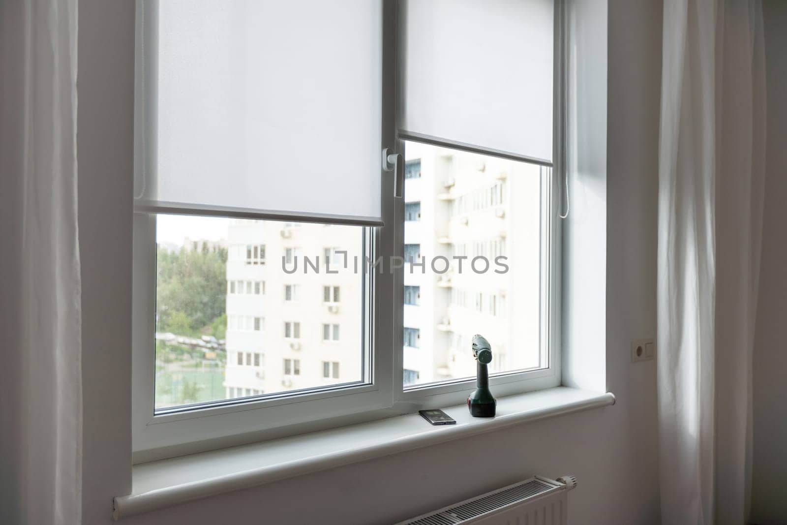 Light room with window and open curtains. Home interior. High quality photo