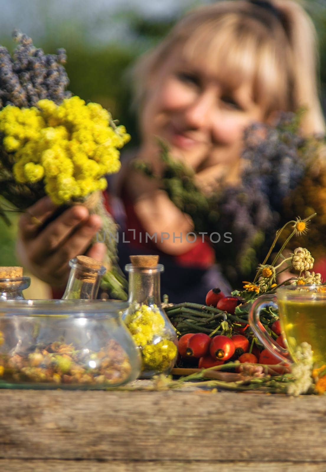 A woman brews herbal tea. Selective focus. by yanadjana