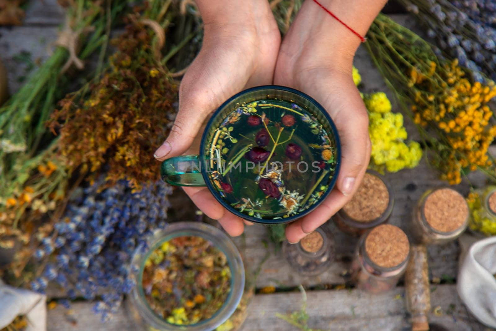 woman brews herbal tea. Selective focus. by yanadjana