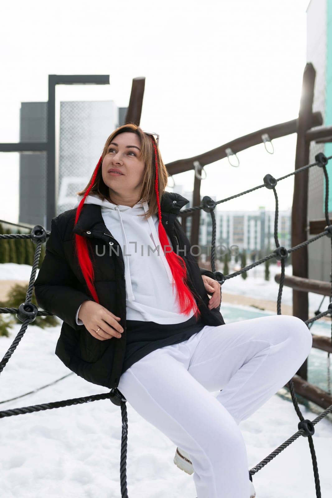 Lifestyle concept, Caucasian woman walking on the playground in the cold.