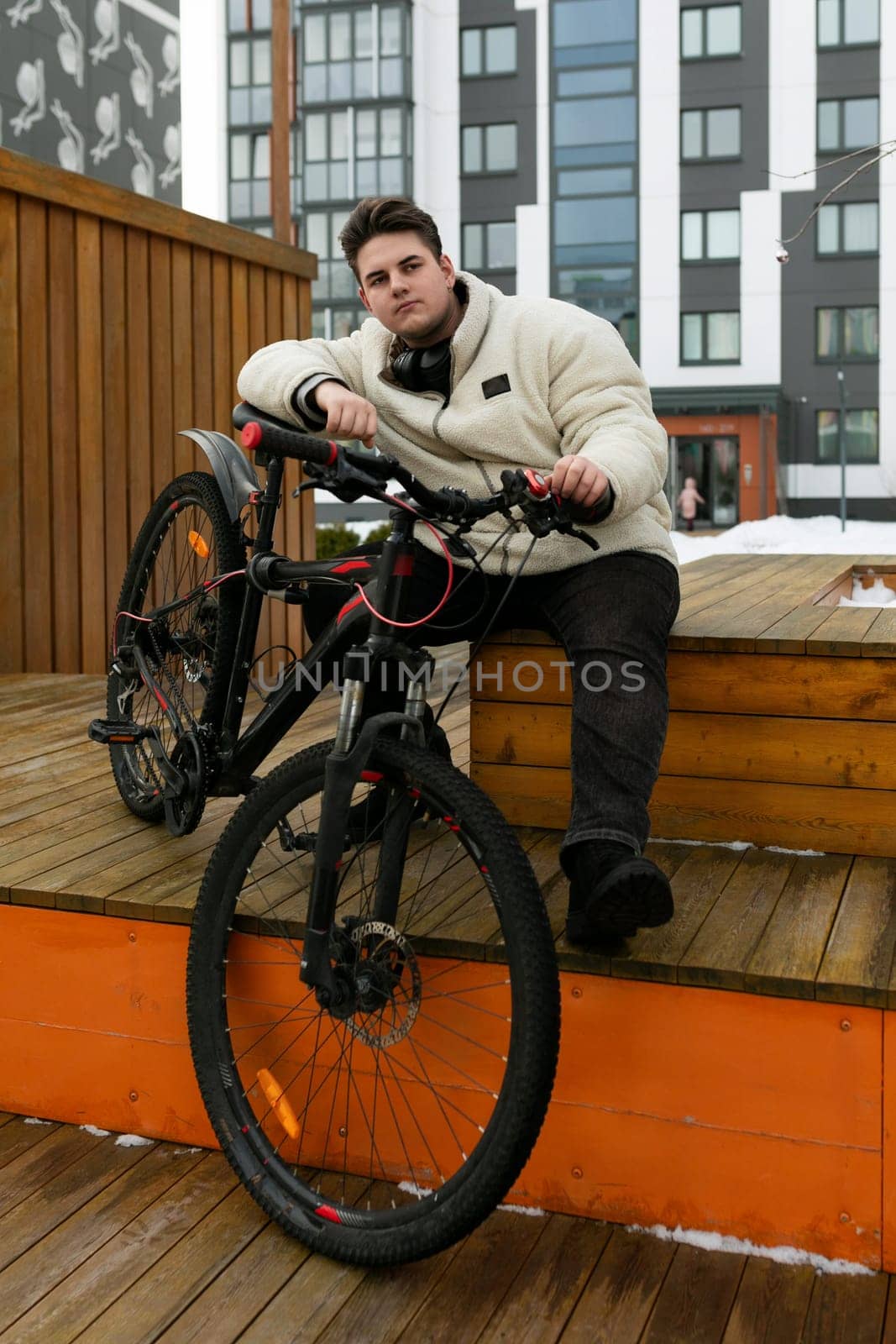 Young European man spends active time with a bicycle by TRMK