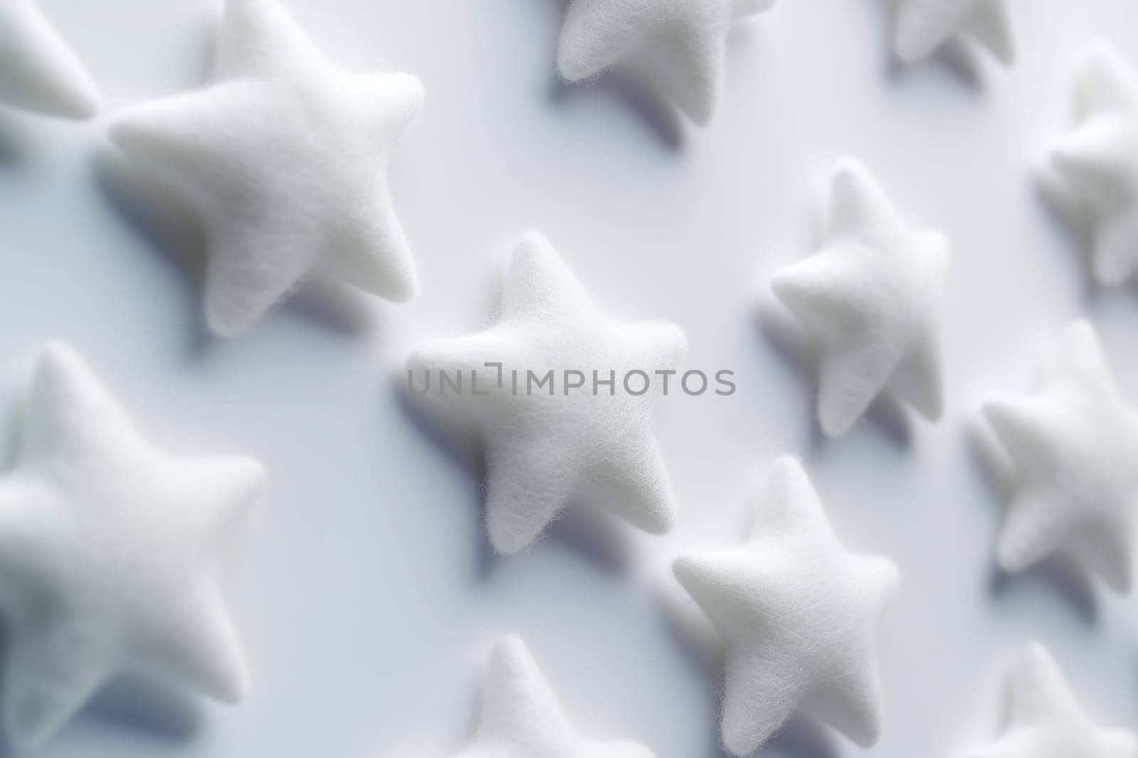 Uniform white star shapes arranged on a plain background