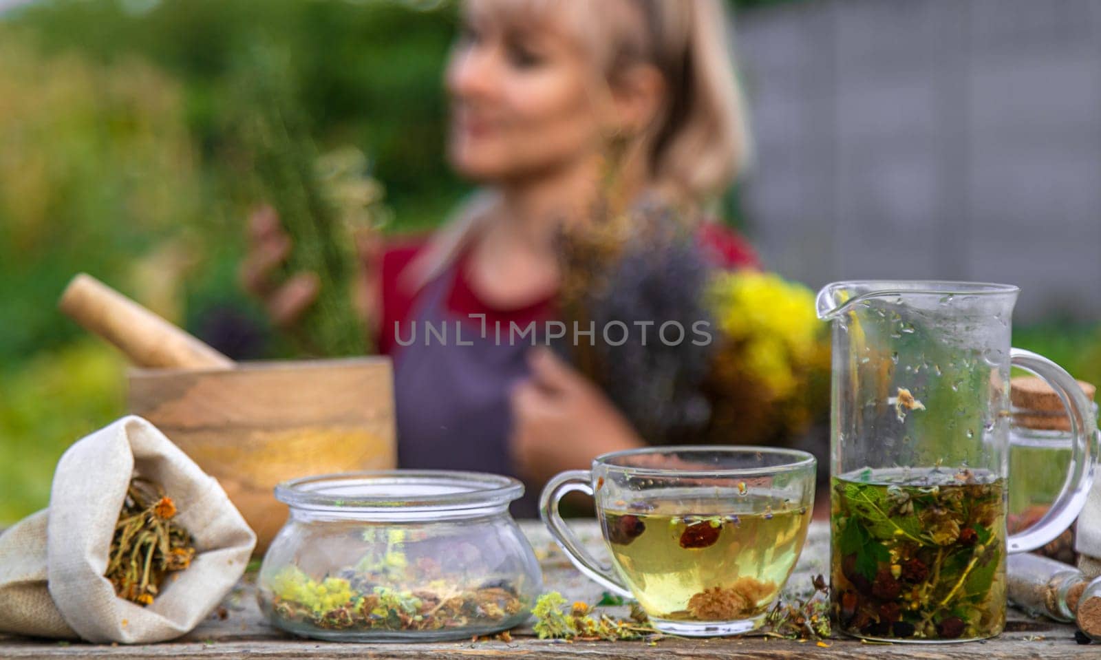 woman brews herbal tea. Selective focus. by yanadjana
