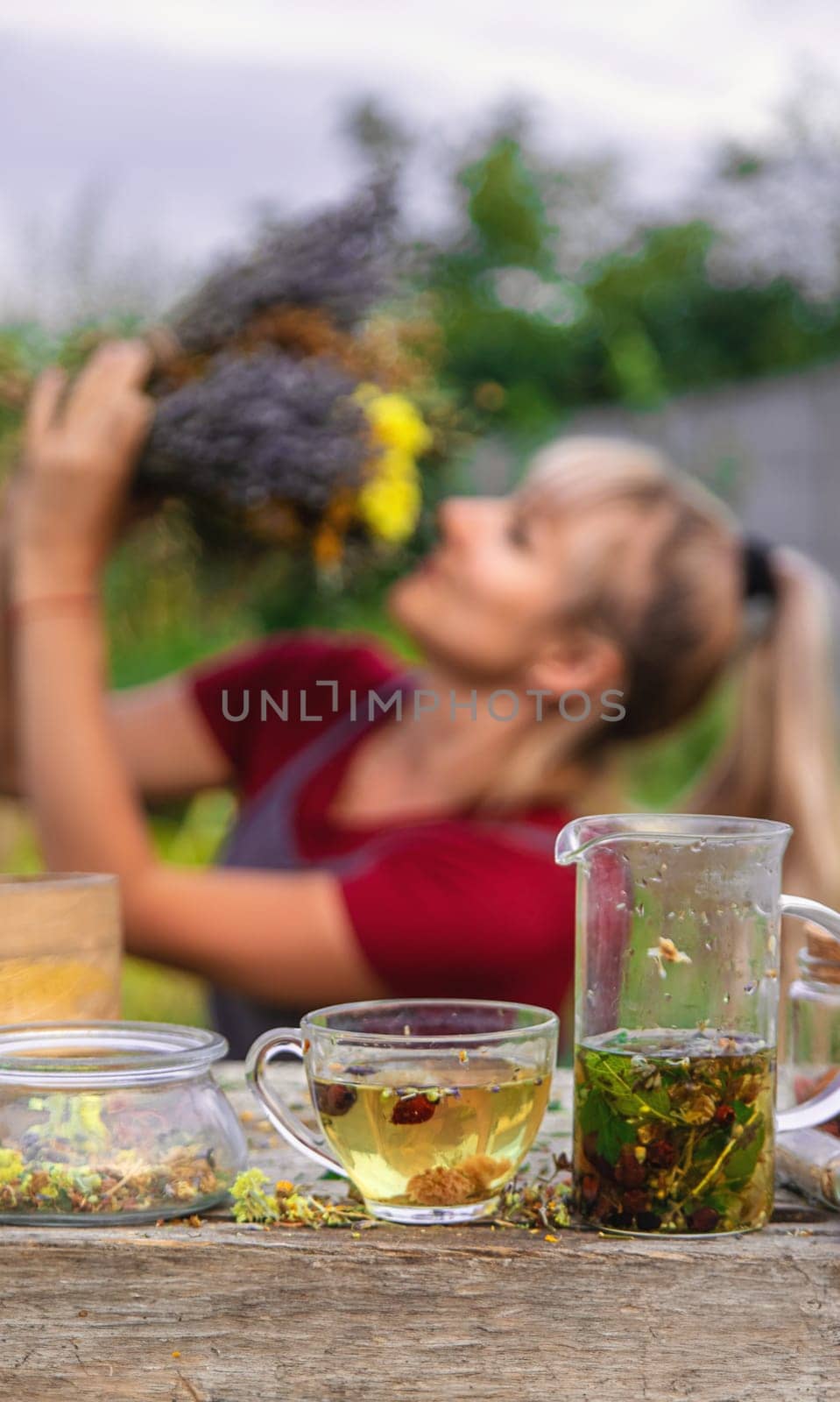 woman brews herbal tea. Selective focus. by yanadjana