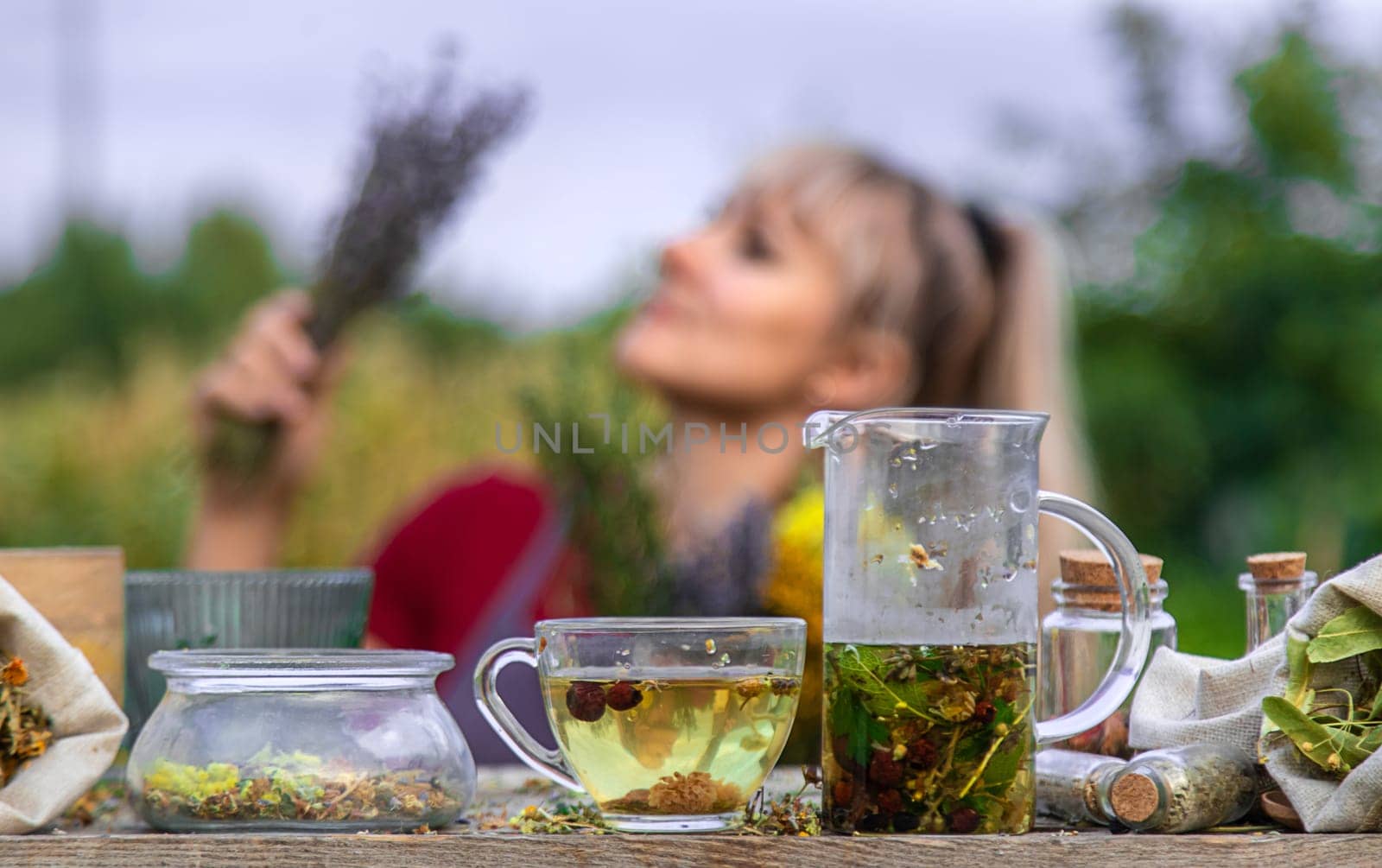 woman brews herbal tea. Selective focus. Nature.