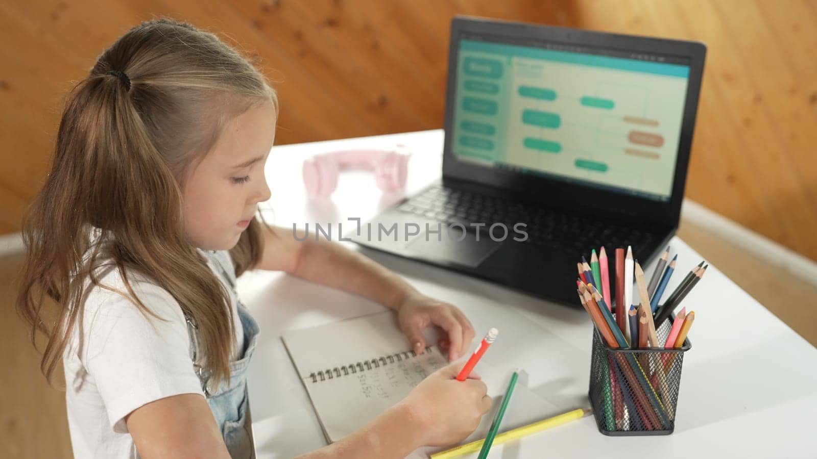 Top view of student thinking while writing or doing homework by using laptop screen display engineering coding program or programing system. Girl think while turn around and showing thumb. Erudition.