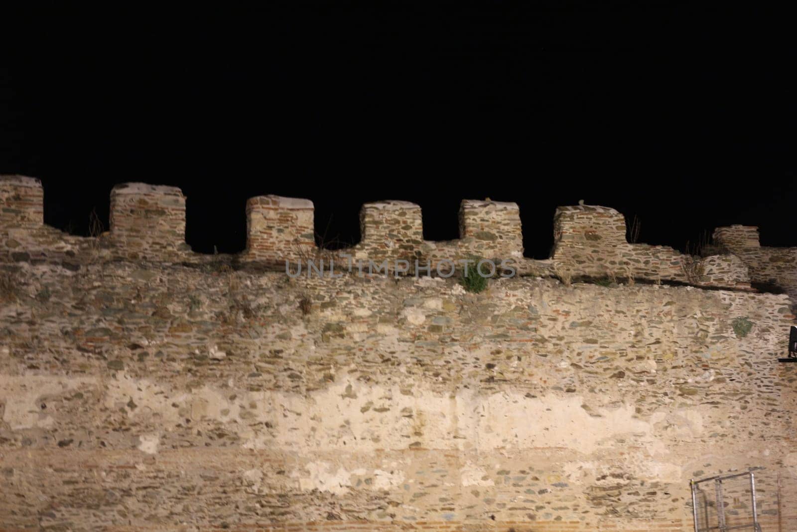 Journey through time and immerse yourself in the mystical allure of Thessaloniki's ancient city walls under the cloak of night