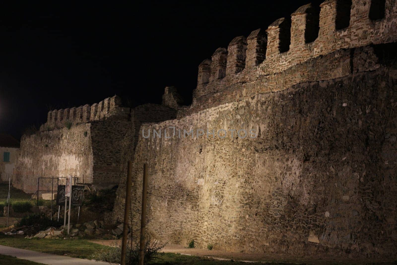 Journey through time and immerse yourself in the mystical allure of Thessaloniki's ancient city walls under the cloak of night