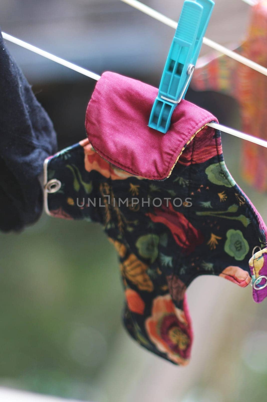 Embrace eco-friendly menstruation with these empowering images of reusable period pads hanging out to dry.