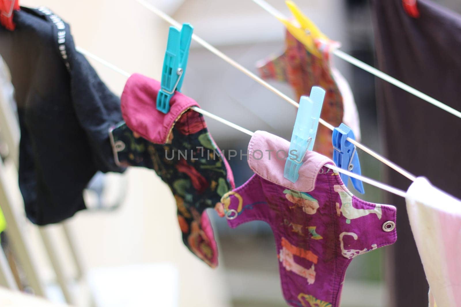 Embrace eco-friendly menstruation with these empowering images of reusable period pads hanging out to dry.