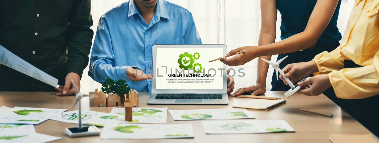 Green technology logo displayed on laptop. Eco conservative concept. Delineation by biancoblue