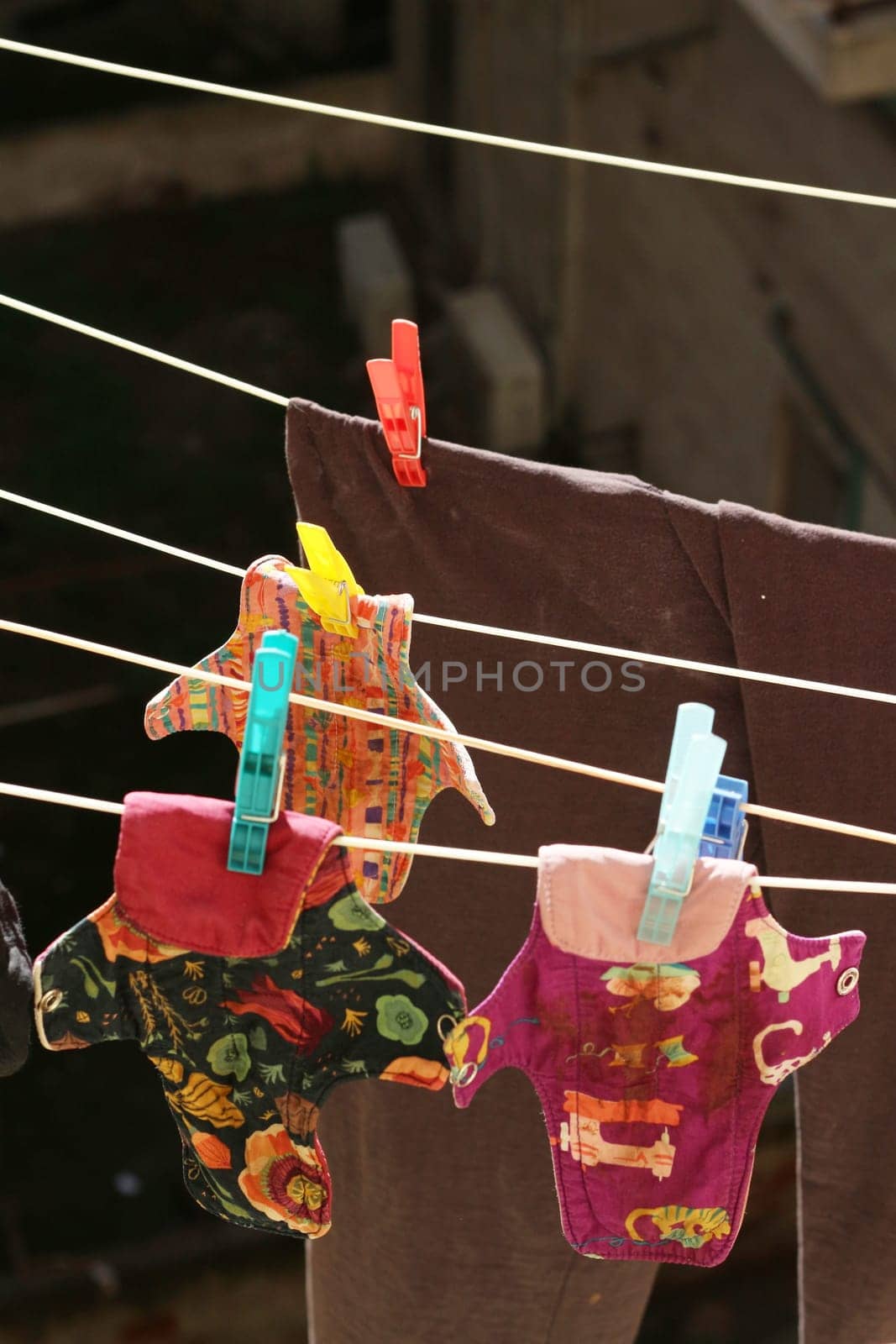 Embrace eco-friendly menstruation with these empowering images of reusable period pads hanging out to dry.