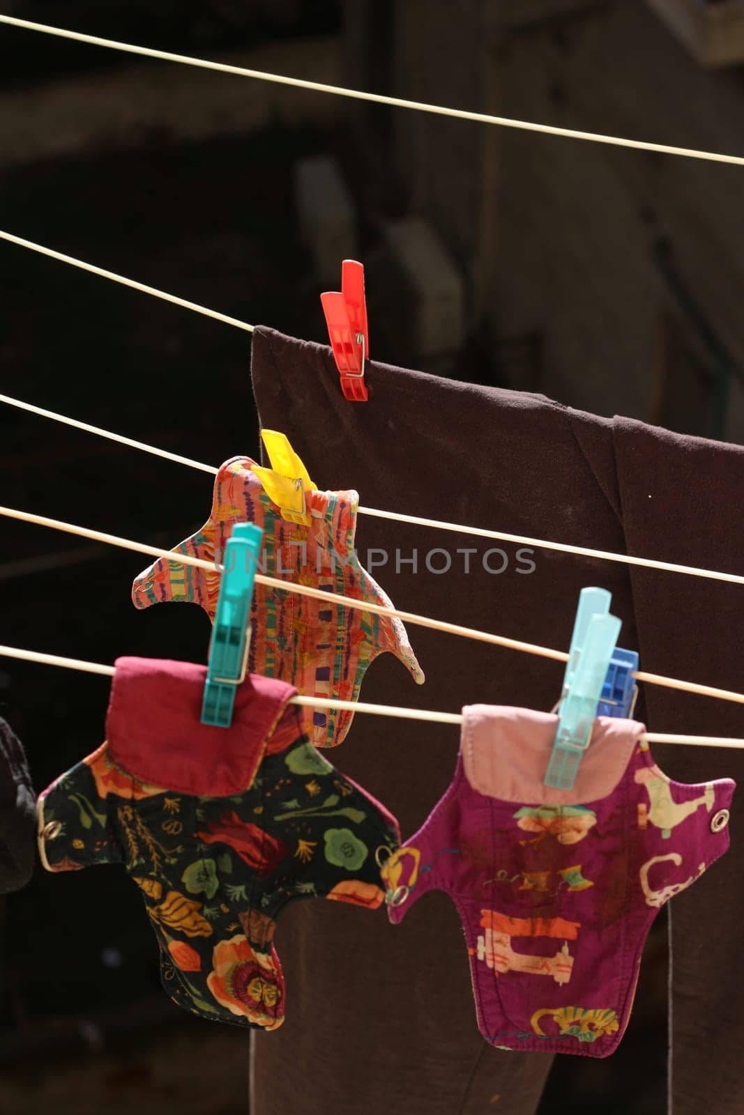 Embrace eco-friendly menstruation with these empowering images of reusable period pads hanging out to dry.