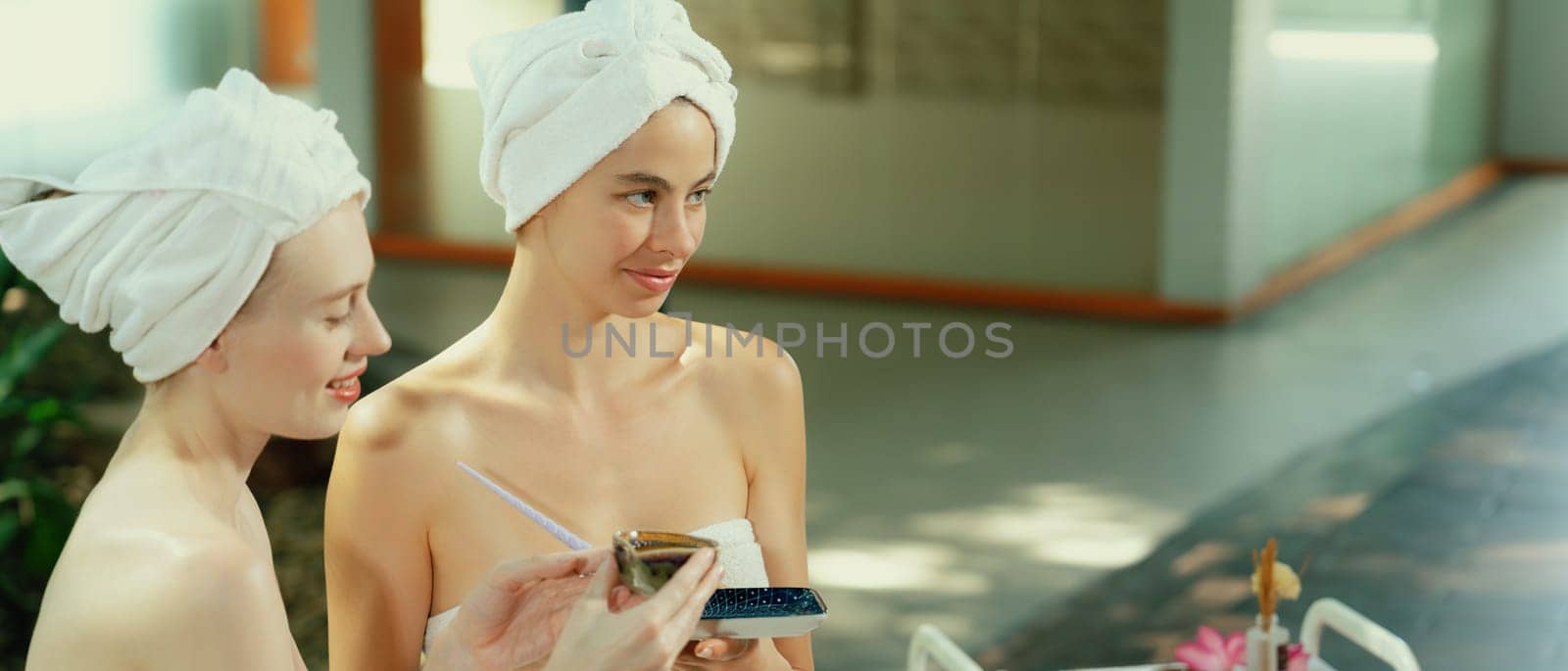 Beautiful caucasian woman using facial mask surrounded by nature. Tranquility. by biancoblue