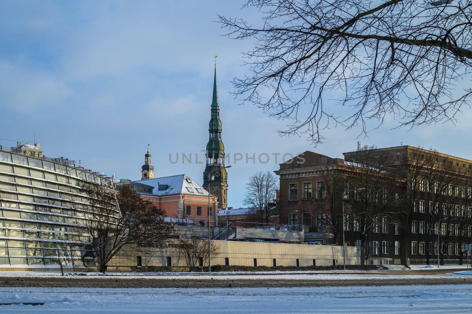 City Hall Square with House of the Blackheads and Saint Peter church in Riga Old Town During sunset time.